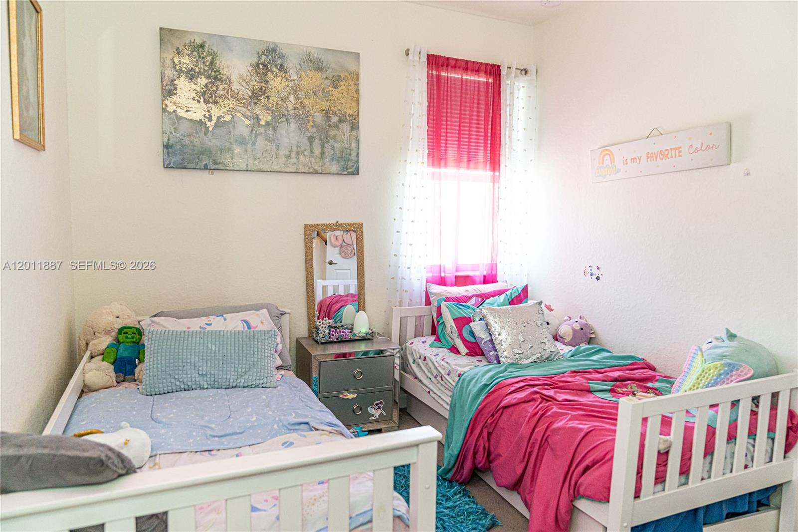 10599 West 33rd Court Hialeah, FL 33018 - Photo 22 of 39 a bedroom with furniture and a couch