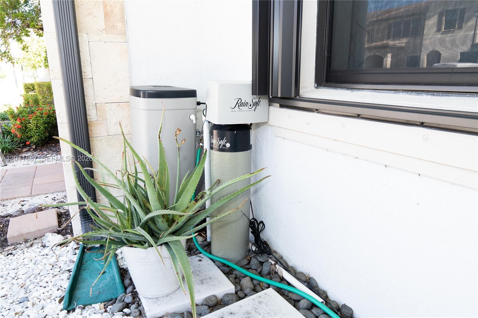 10599 West 33rd Court Hialeah, FL 33018 - Photo 27 of 39 a view of potted plant in front of a door