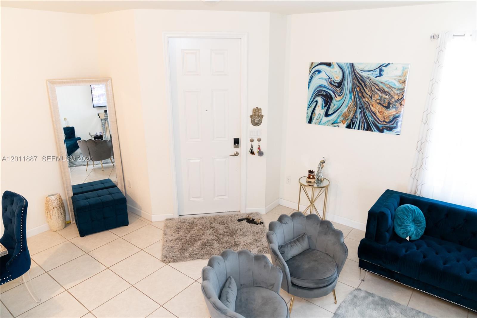 10599 West 33rd Court Hialeah, FL 33018 - Photo 4 of 39 a living room with furniture