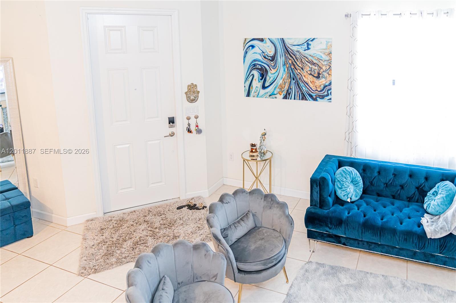 10599 West 33rd Court Hialeah, FL 33018 - Photo 5 of 39 a bedroom with a bed and couch