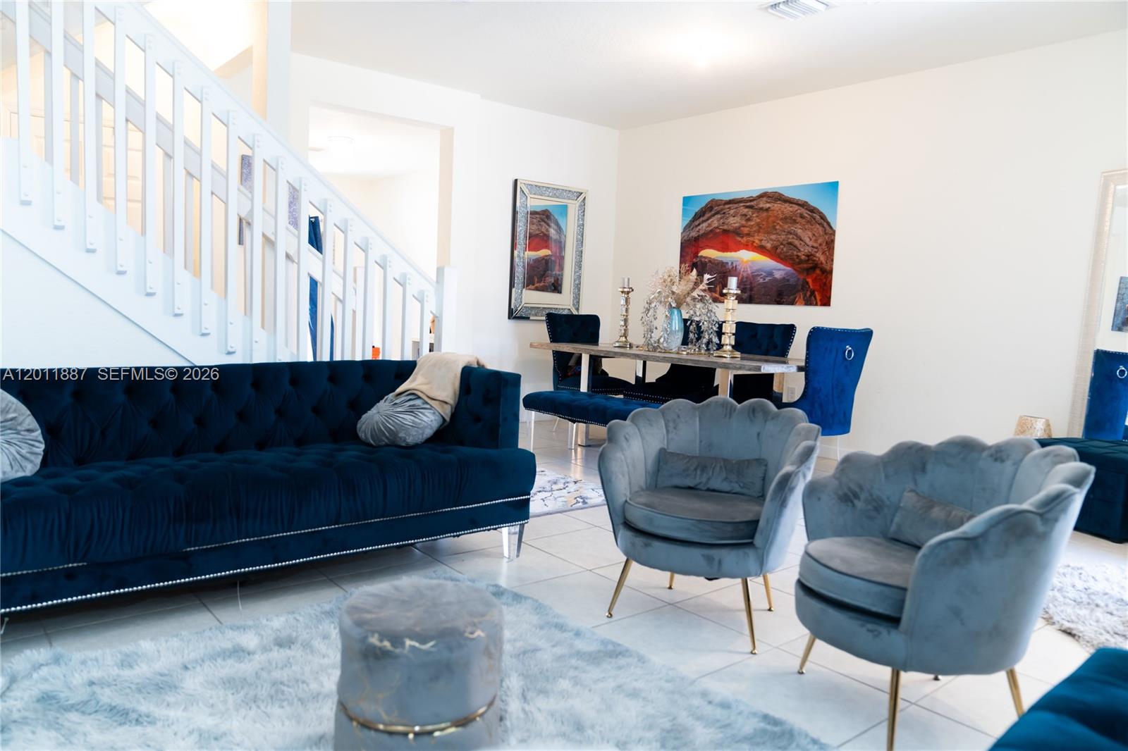 10599 West 33rd Court Hialeah, FL 33018 - Photo 6 of 39 a living room with furniture and a painting