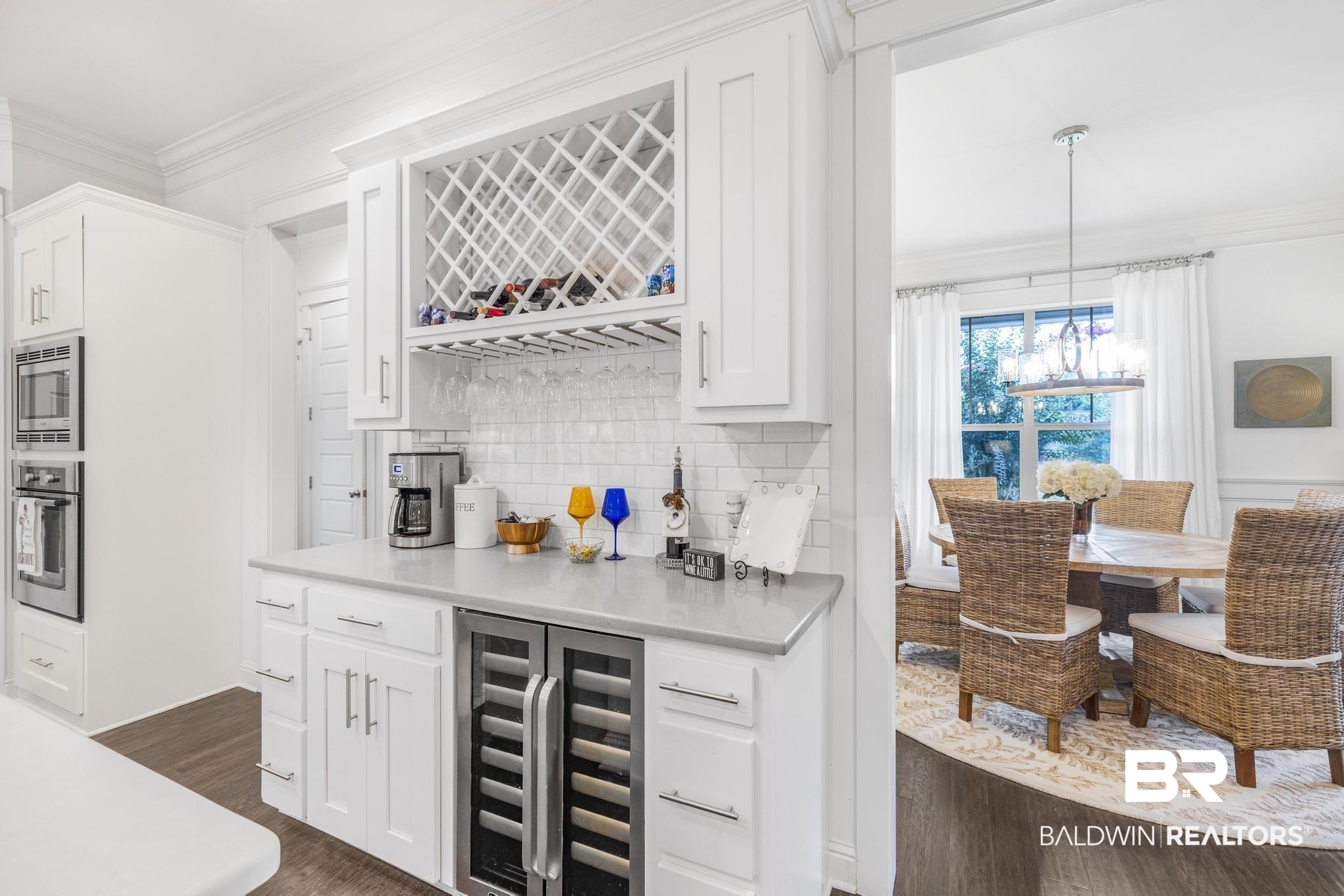 29949 Dolive Ridge Daphne, AL 36527 - Photo 15 of 55 Built-in beverage station featuring a wine rack, under-counter wine refrigerator, and light-toned countertops