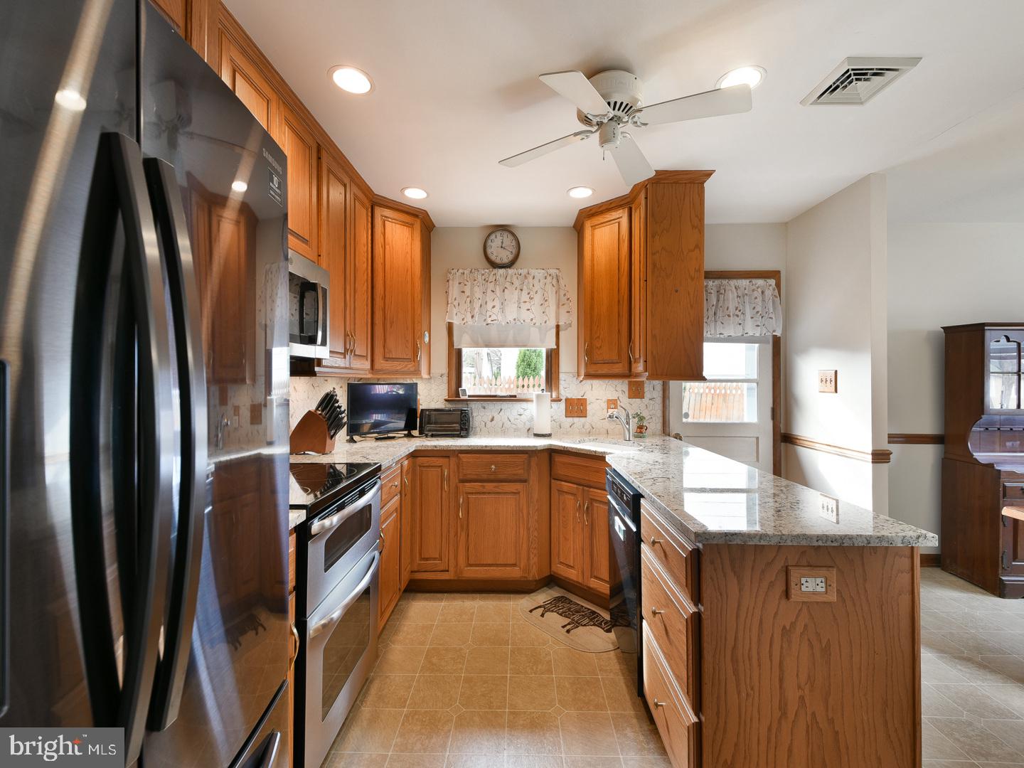 127 Ellis Road Willow Grove, PA 19090 - Photo 15 of 38 a kitchen with stainless steel appliances granite countertop a sink stove and refrigerator