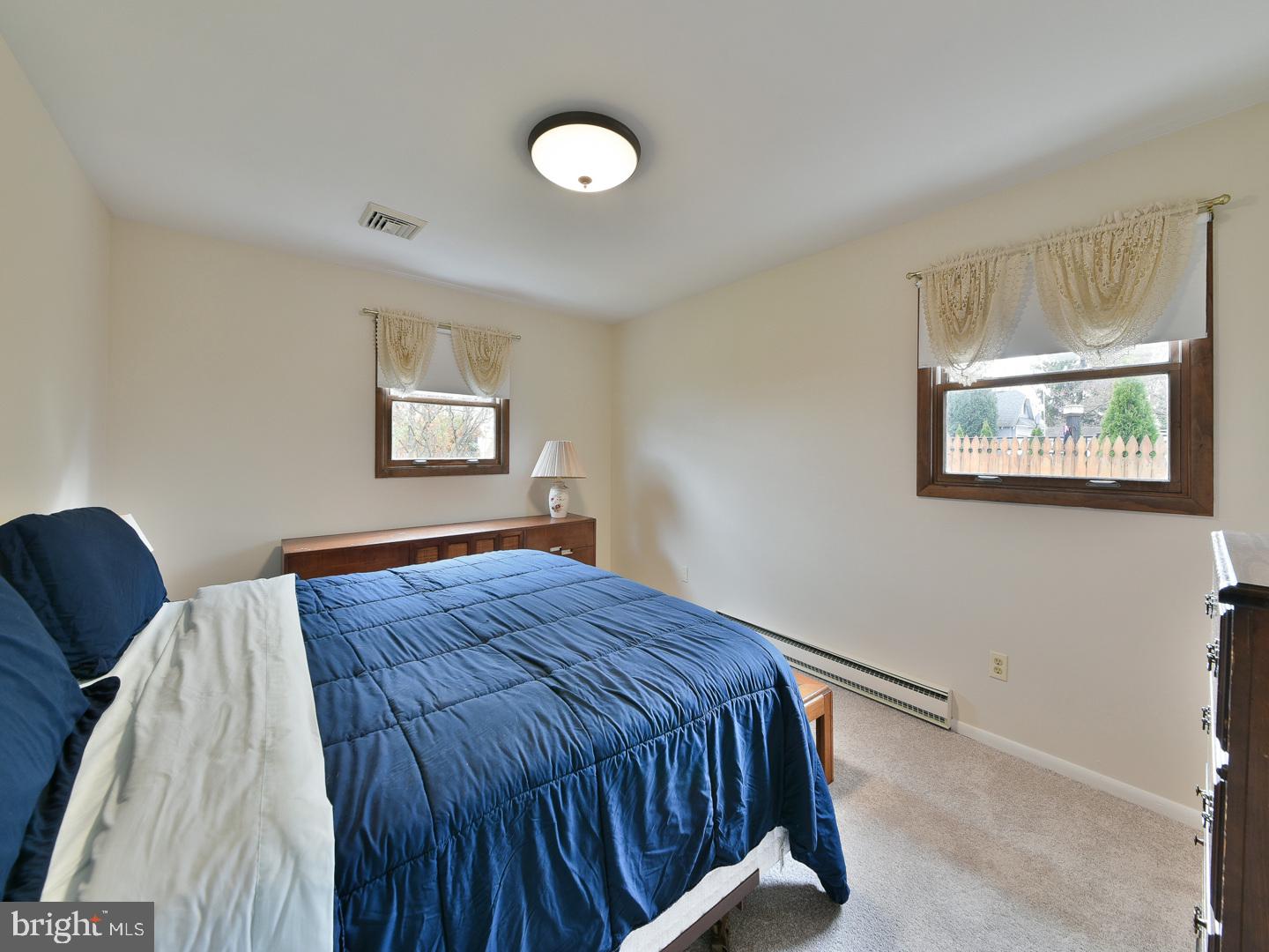 127 Ellis Road Willow Grove, PA 19090 - Photo 17 of 38 a bedroom with a bed and wooden floor