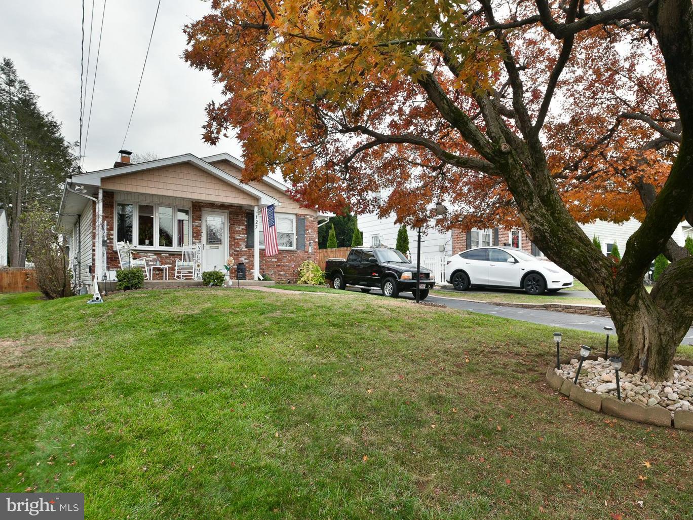 127 Ellis Road Willow Grove, PA 19090 - Photo 3 of 38 a front view of a house with a garden and trees