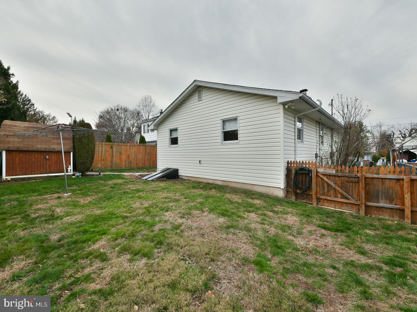 127 Ellis Road Willow Grove, PA 19090 - Photo 33 of 38 a backyard of a house with lots of green space
