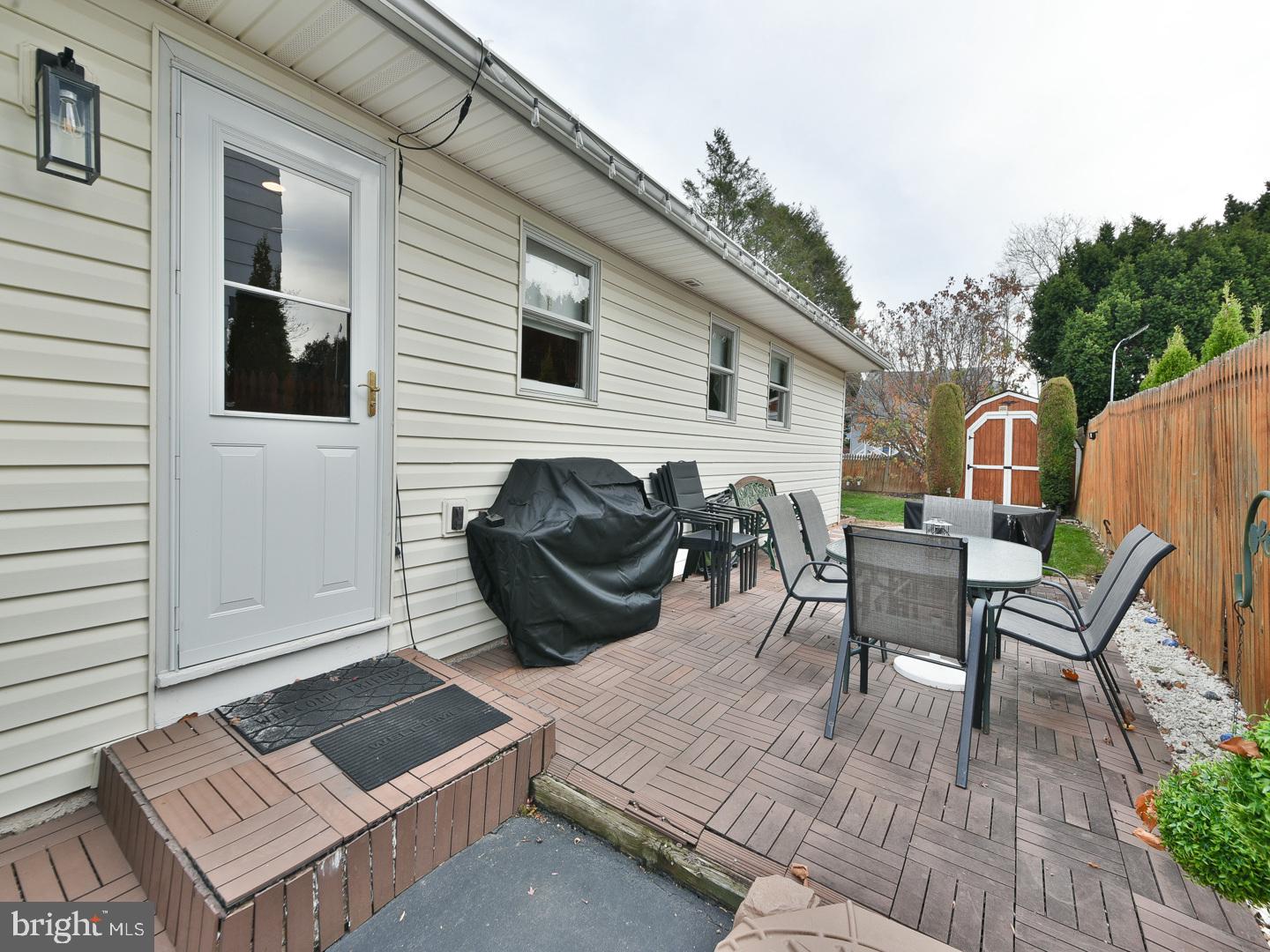 127 Ellis Road Willow Grove, PA 19090 - Photo 35 of 38 a view of a dinning table and chairs in patio of the house