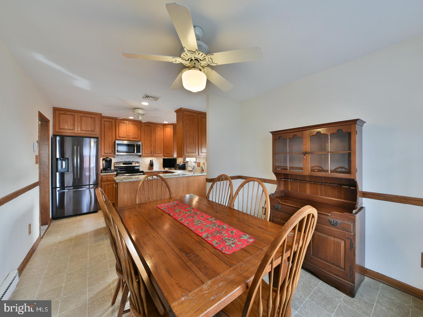 127 Ellis Road Willow Grove, PA 19090 - Photo 10 of 38 a living room with furniture a flat screen tv and kitchen view