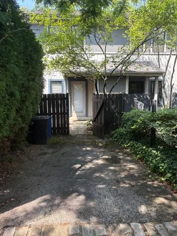 a view of a house with a tree