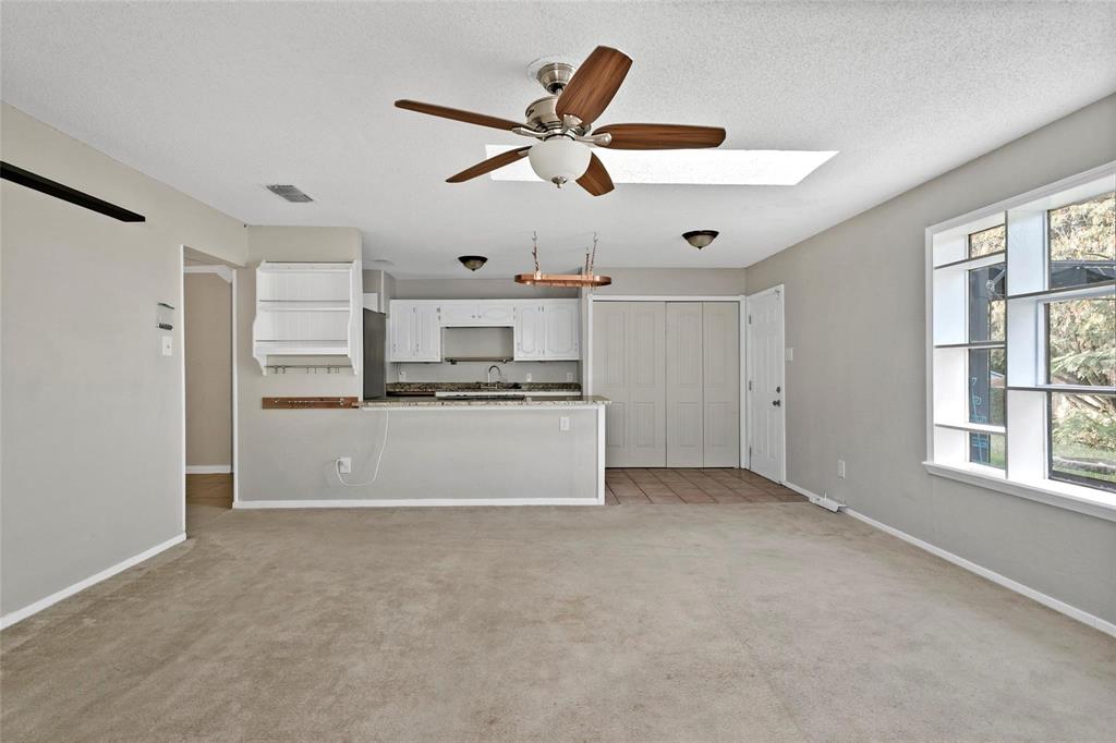 6104 Kelly Elliott Road Arlington, TX 76001 - Photo 18 of 25 a view of kitchen with cabinets and window