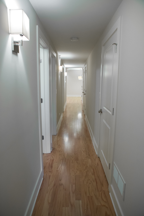 Undisclosed Address Chicago, IL 60657 - Photo 5 of 8 a view of a hallway with wooden floor