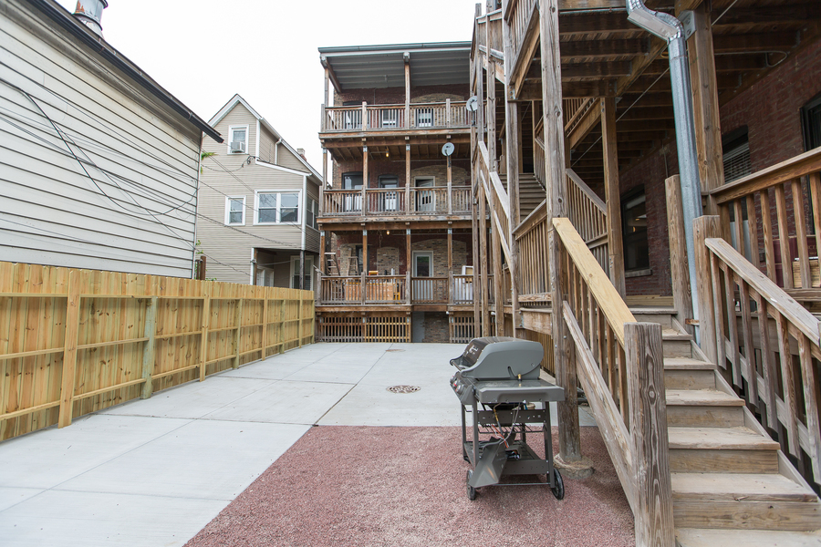 Undisclosed Address Chicago, IL 60657 - Photo 8 of 8 a backyard of a house with table and chairs