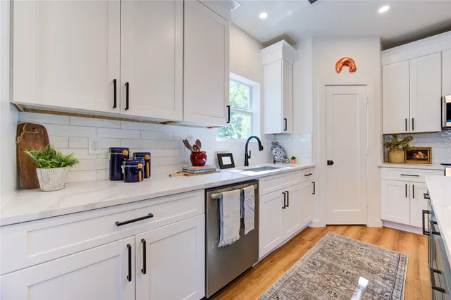 a kitchen with lots of counter top space and living room