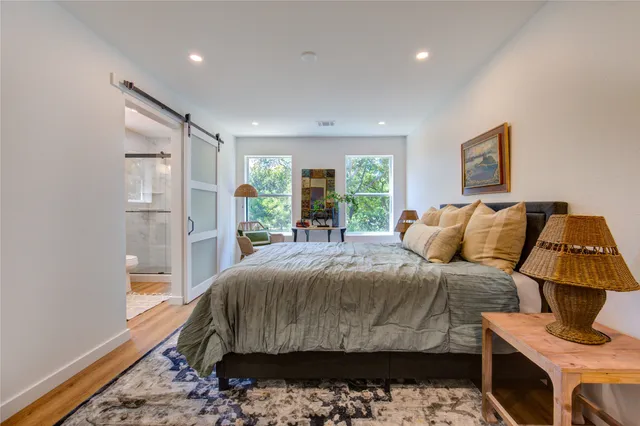 a bed room with a bed and a lamp