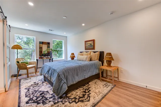a bedroom with bed and window
