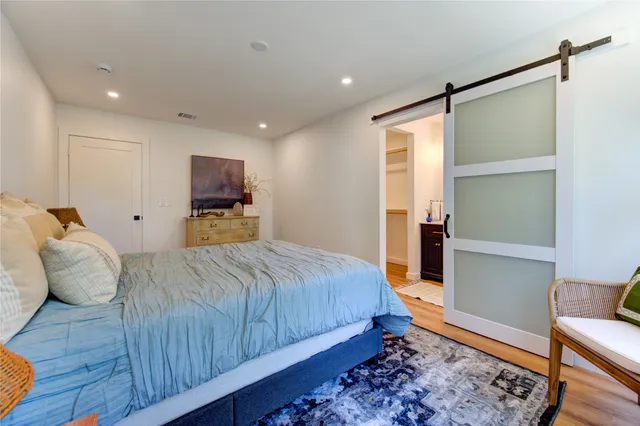 a bathroom with a double vanity sink toilet and shower