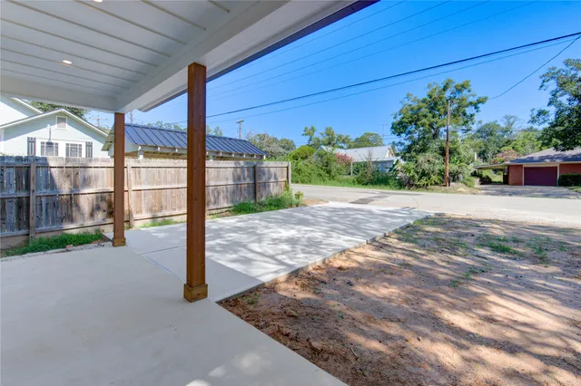 a living room with furniture dining table and a large window