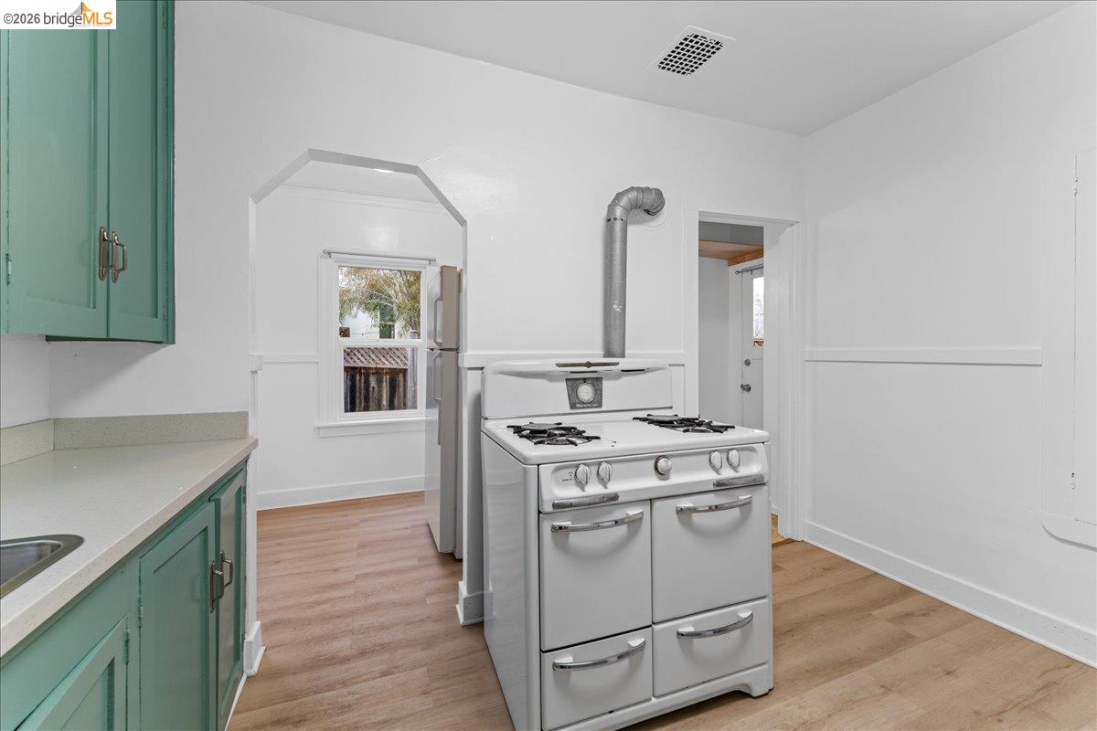 1127 Key Rte Boulevard Albany, CA 94706 - Photo 19 of 36 a kitchen with a stove top oven and sink
