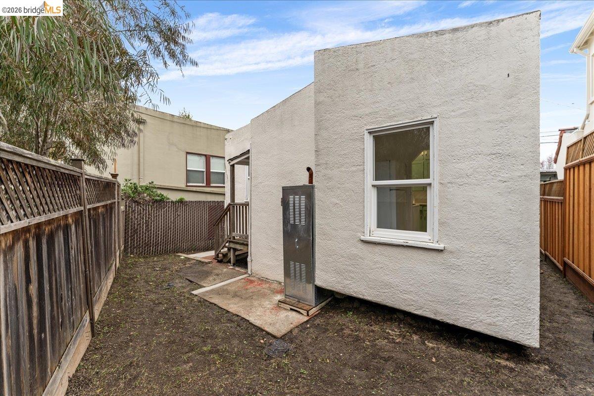 1127 Key Rte Boulevard Albany, CA 94706 - Photo 25 of 36 Back of house featuring a fenced backyard and stucco siding