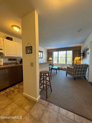 a view of a livingroom with furniture and windows