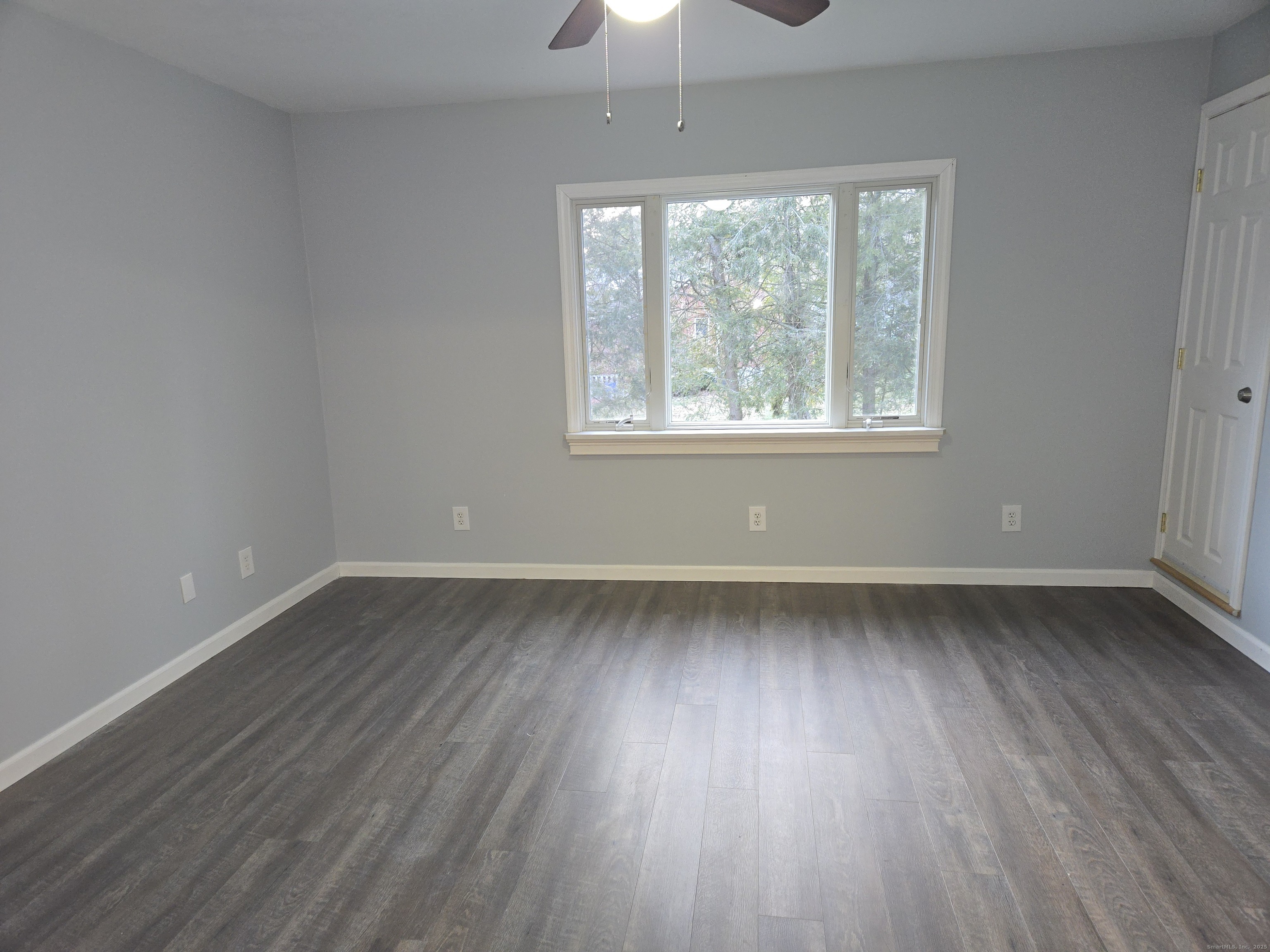 329 Mohegan Road, Unit A Shelton, CT 06484 - Photo 12 of 12 wooden floor in an empty room with a window
