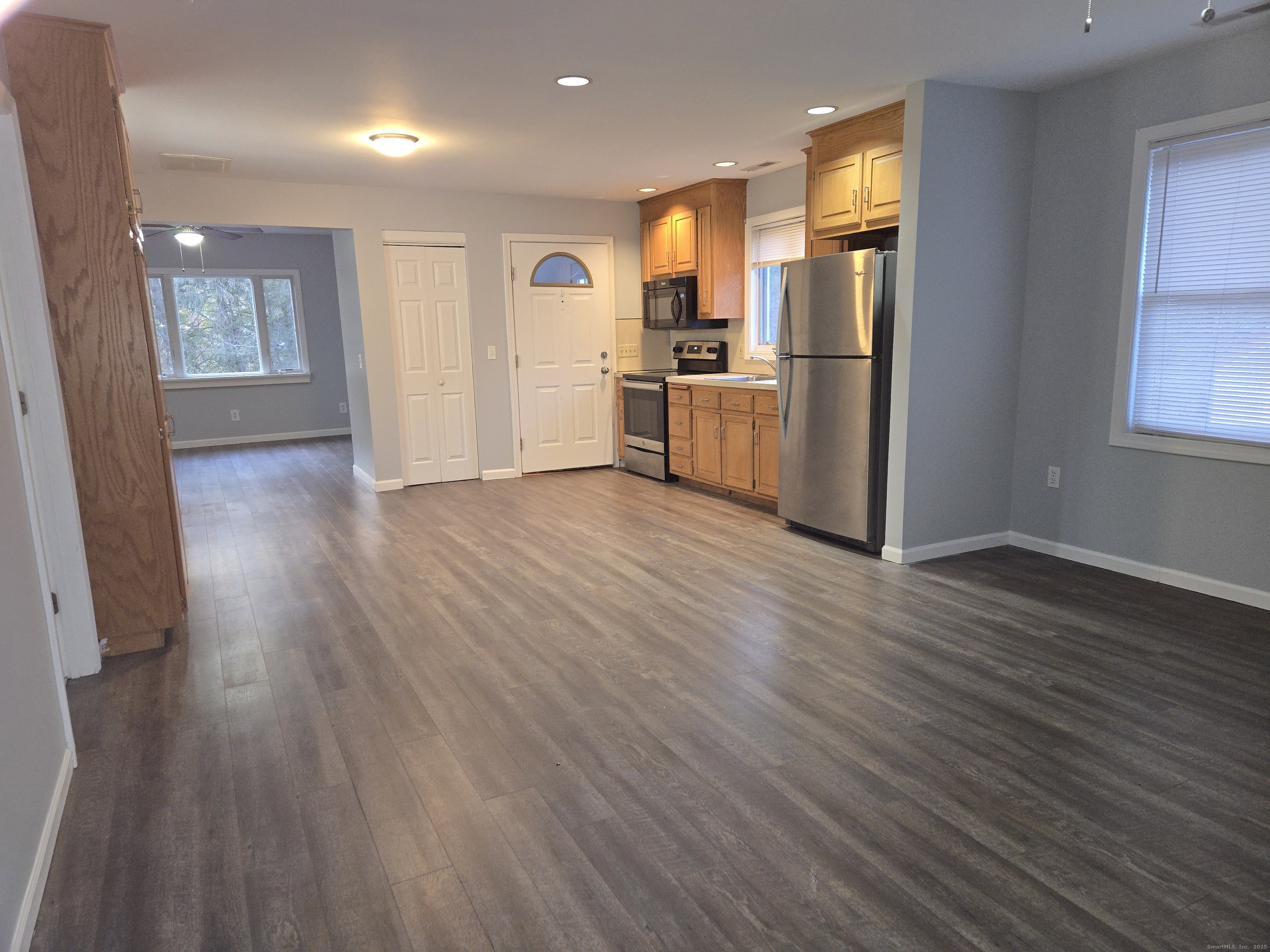 329 Mohegan Road, Unit A Shelton, CT 06484 - Photo 4 of 12 a view of kitchen view wooden floors appliances and cabinets