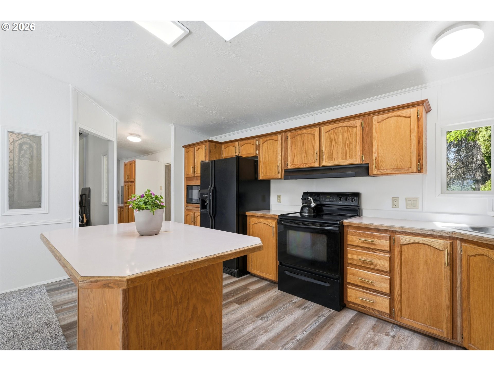 11661 Southwest Spring Hill Road Gaston, OR 97119 - Photo 15 of 45 a kitchen with stainless steel appliances granite countertop a stove a sink dishwasher and a refrigerator