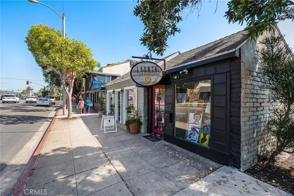 a view of a pathway of a building and a entrance gate