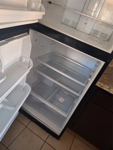 a bathroom with a toilet and a bathtub
