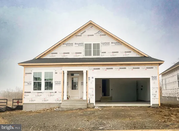 a front view of a house with a garage