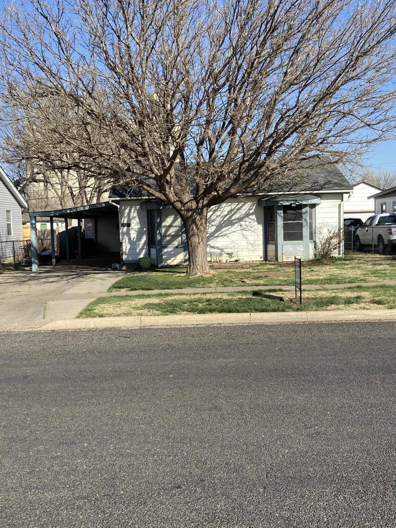 4339 South Tyler Street Amarillo, TX 79110 - Photo 1 of 11 a view of a house with a yard and garage