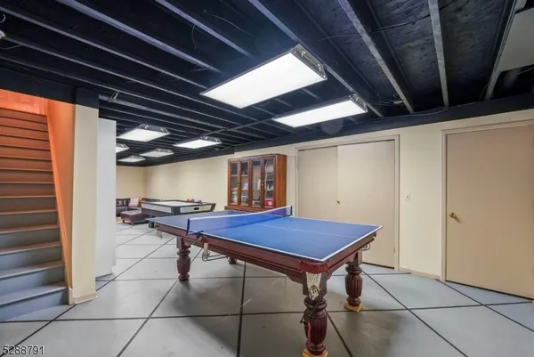a view of a room with table and chairs