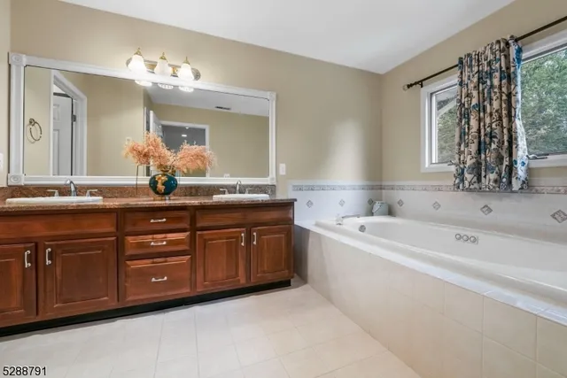 a bathroom with a tub and a window