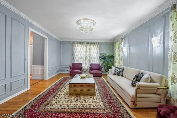 a living room with furniture and a rug