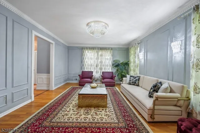 a living room with furniture and a rug
