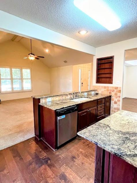 3913 100th Street Lubbock, TX 79423 - Photo 14 of 35 a kitchen with stainless steel appliances granite countertop a stove and a sink