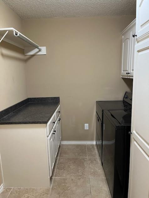 3913 100th Street Lubbock, TX 79423 - Photo 32 of 35 a kitchen with a sink and a refrigerator