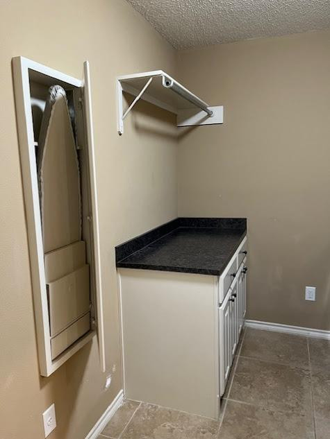 3913 100th Street Lubbock, TX 79423 - Photo 33 of 35 a view of a storage and utility room with refrigerator and window