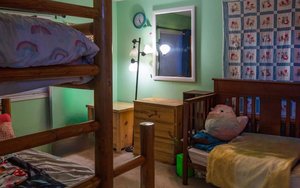 100 Ski Trails Road, Unit 40 Mammoth Lakes, CA 93546 - Photo 12 of 15 a bedroom with a bed and window