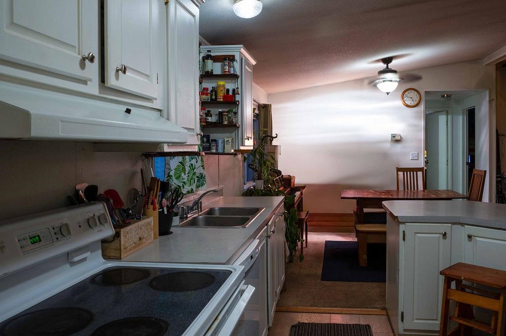 100 Ski Trails Road, Unit 40 Mammoth Lakes, CA 93546 - Photo 5 of 15 a kitchen with stainless steel appliances a sink stove and cabinets
