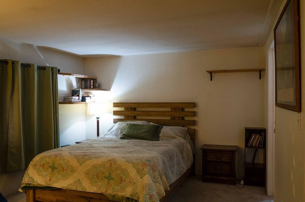 100 Ski Trails Road, Unit 40 Mammoth Lakes, CA 93546 - Photo 8 of 15 a bedroom with a bed and wooden floor