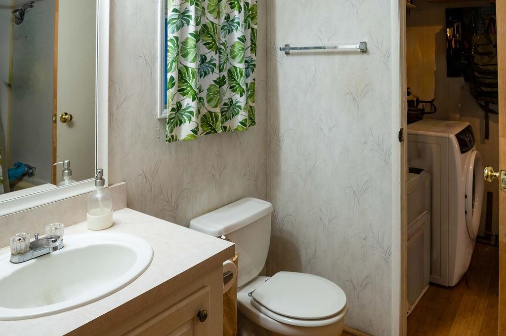 100 Ski Trails Road, Unit 40 Mammoth Lakes, CA 93546 - Photo 10 of 15 a bathroom with a toilet sink and mirror