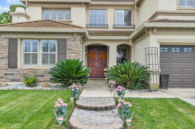a view of a hallway with a furniture and front door