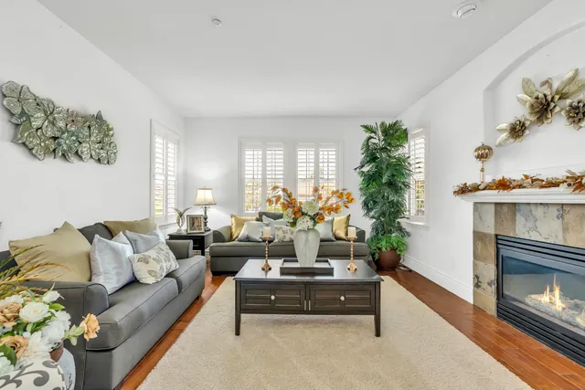 a bathroom with a granite countertop sink a large mirror and a bathtub