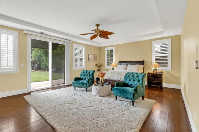 a living room with furniture a lamp and a fireplace
