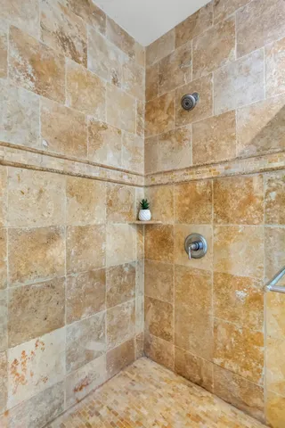 a living room with furniture a chandelier and a rug