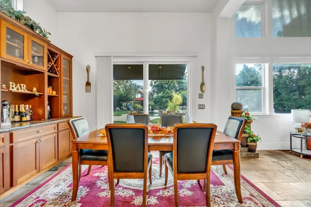 a bed room with a bed and a chandelier