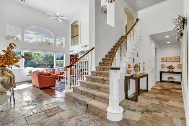 a front view of house with yard and green space