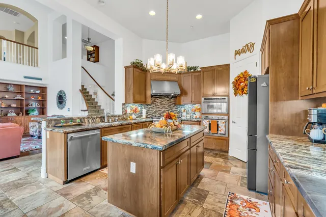 a swimming pool view with a seating space and a garden