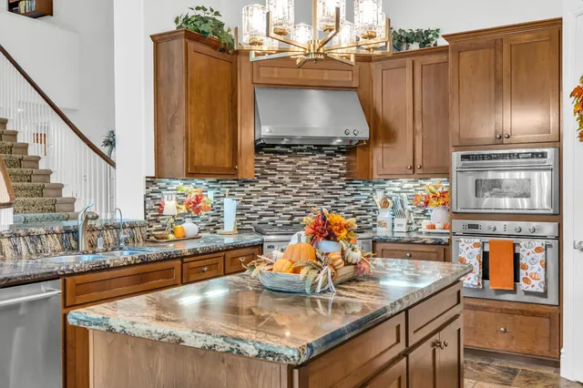 a view of house with outdoor space and swimming pool